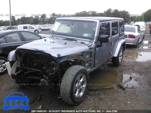 2014 Jeep Wrangler Unlimited SAHARA 1C4HJWEG0EL143237 зображення 1